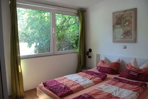 Modernly Furnished Bungalow with Fireplace, Surrounded by Greenery.