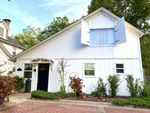 Experience History in an original Carriage House located behind a Colonial home. - 4-Star
