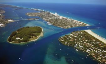 a bird 's eye view of a city with water and land in the middle of it at Marriott's Oceana Palms