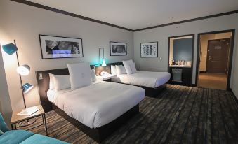 a hotel room with two beds , one on the left and one on the right side of the room at Thunder Valley Casino Resort