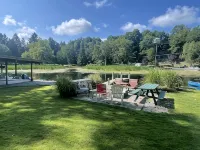 Cottage 1 is a charming 2 bedroom only 25’ from its boat dock & Hamlin lake. Hotel a Hamlin Township