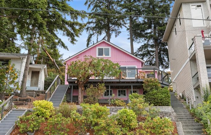 Darling pink beach house with epic views in a cozy community.