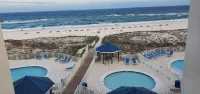 Cozy Beach Condo with Private Beach, Heated Pool, High Speed WiFi, and More.