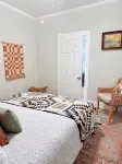 Refined Miner’s Cottage: Fenced Yard, Screened Porch.