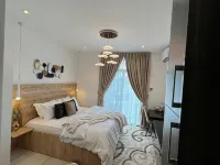 Embassy Gardens Luxury Suites Cpg Hotels near Labadi