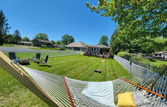 Spacious 4-bedroom waterfront house in Sylvan Beach with private yard and dock.