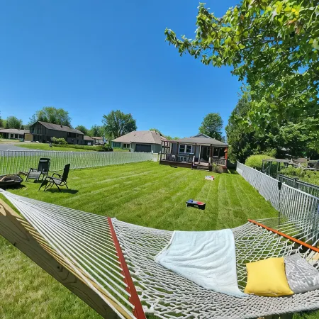 Spacious 4-bedroom waterfront house in Sylvan Beach with private yard and dock.