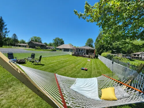 Spacious 4-bedroom waterfront house in Sylvan Beach with private yard and dock.