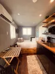 Tiny house on an acre with ocean view and private infinity pool.