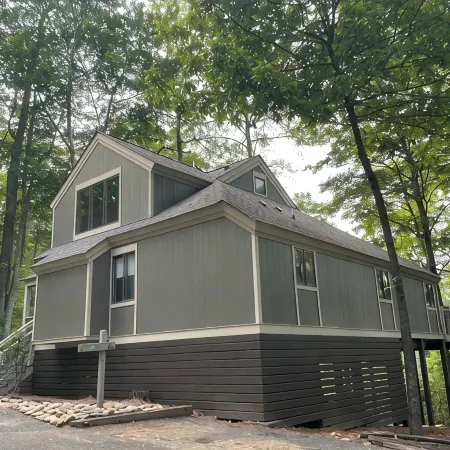 Breathtaking lake views, steps from beach, golf, and clubhouse. Renovated home!