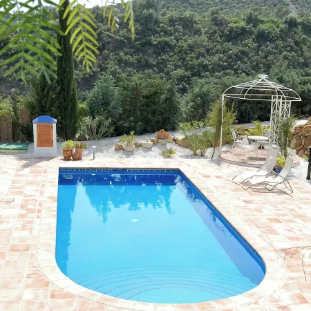 3 bed villa surrounded with tropical gardens with private pool 2 km from town.