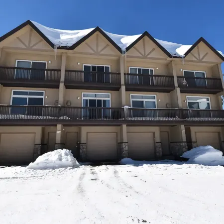 Three-story townhome tucked back in the woods near Winter Park