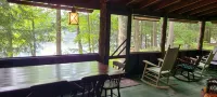 Lakefront Rustic 1930s dog friendly Cabin w/lg screened porch near Lake George - Wi-Fi
