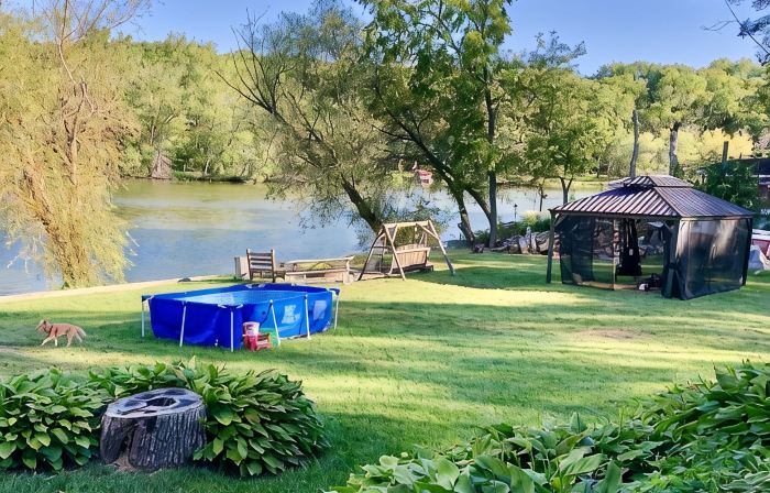 220’ Waterfront Rock River WI Beach Home Deal!Pier Pools FP Fishng Boat & Kayaks