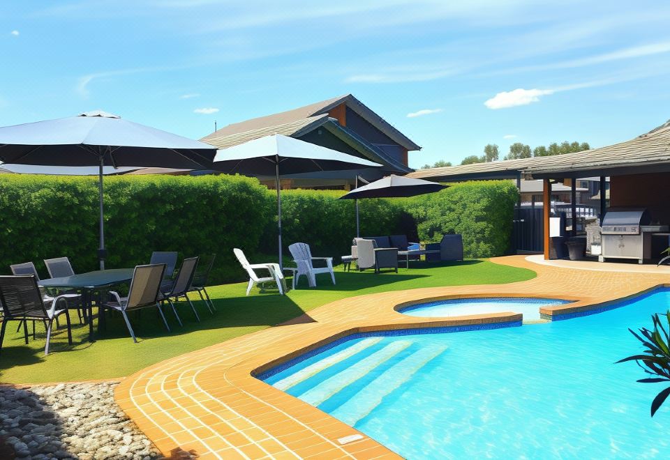 a backyard with a pool surrounded by chairs and umbrellas , creating a relaxing atmosphere for guests at The Heritage Bendigo
