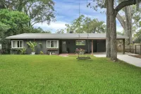 Mid-Century Boho Chic home with Pool, Game Room & Outdoor Playhouse.