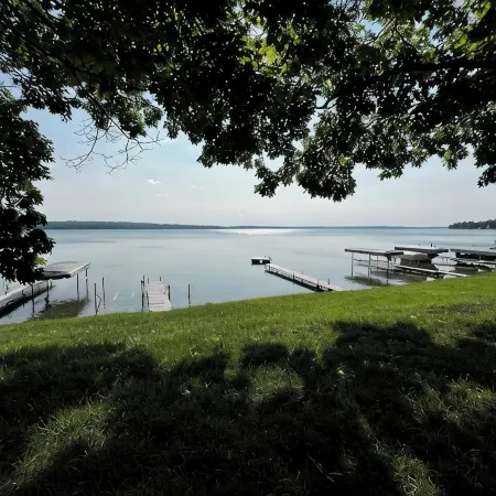 Charming 2-bedroom cabin sits on 2.5 acres on Hubbard Lake.