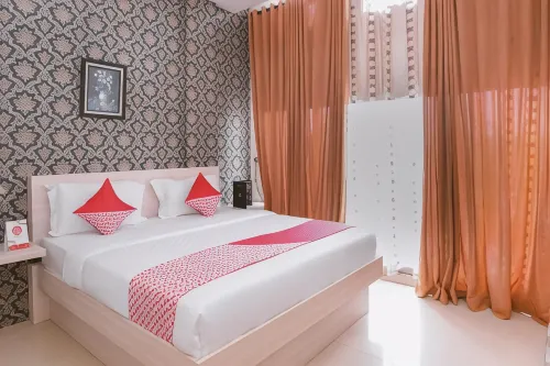 OYO 854 Ub Caisar Hotel Hotel di Jeulingke