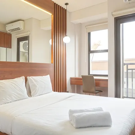Relaxing and Homey Studio Transpark Cibubur Apartment By Travelio