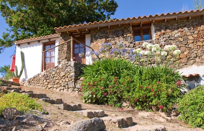 Cozy cottage with a garden in the middle of nature