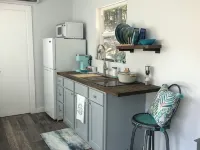 Charming shipping container home with lake view and boat ramp.