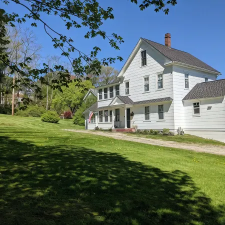 Enjoy comfortable elegance in this secluded grand home located in town