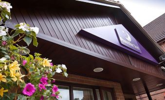 "a building with a sign that reads "" crowne plaza "" prominently displayed on the front of the building" at Premier Inn Maidstone (West Malling) hotel