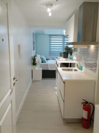 Blissful Haven at Azure North w/  Big TV Netflix Washer Wifi Bed & Sofabed Отели рядом с достопримечательностью «Don Honorio Ventura Technological State University, Sto. Tomas Campus»