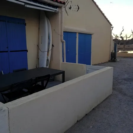 House on the edge of a marine pond close to the beach