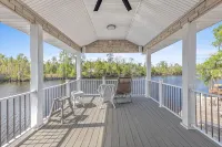 Luxury riverfront home w/ pool, fishing dock, & boat house w/ lift ! Sleeps 14