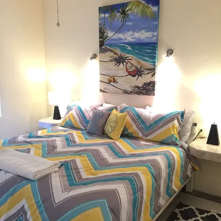 Quiet and serene ocean front 2-bedroom 2-bathroom condo, steps from the sand!