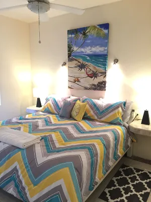 Quiet and serene ocean front 2-bedroom 2-bathroom condo, steps from the sand!