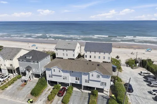 Not quite ocean front, but almost! Just a few steps to the sand! Pet friendly. - Hot Tub