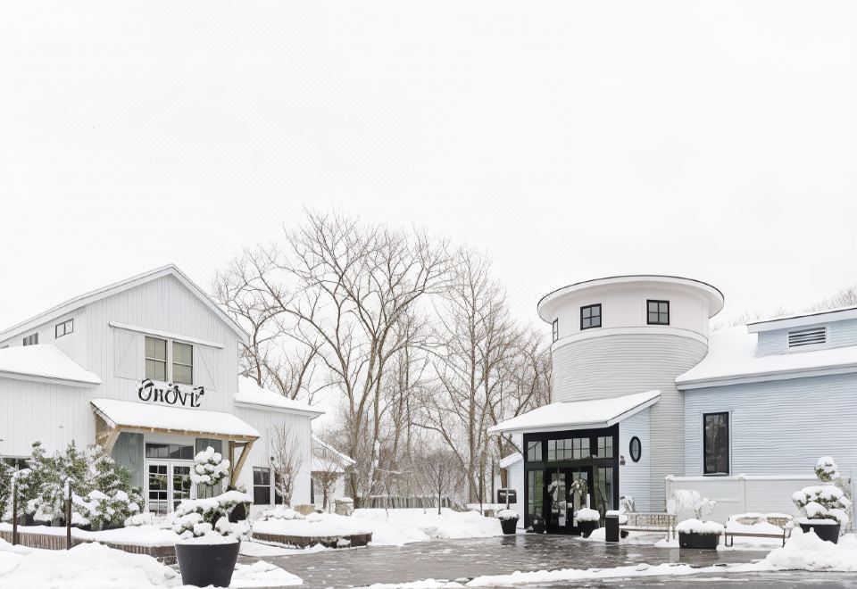 "a snowy scene with a building and trees , one of which has the words "" keir "" on it" at Briar Barn Inn