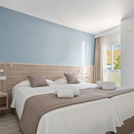 Puerto Azul Suite Hotel Отели в г. Польенса