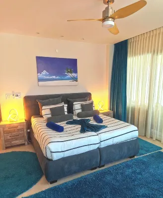 Gorgeous Eagle Beach 4-bedroom Condo with surround balcony and fitness room - Boutique