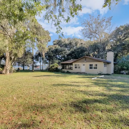 Lakefront home on Lake Kerr near Salt Springs with large porch and great yard