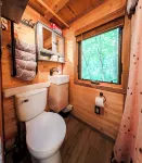 Tiny bungalow secluded in the woods with lake view.  Pets accepted!
