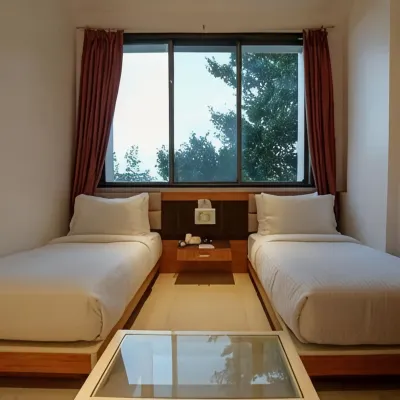 Rester Select Chakan Hotels near Ambika Mangal Karyalay, Shiroli