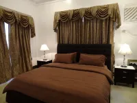 The Executive Villa Inn & Suites - Homestays