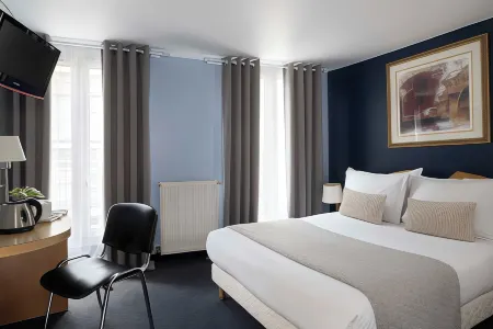 Grand Hotel du Calvados - Opera Отели рядом с достопримечательностью «Мулен Руж»