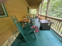Spacious suite surrounded by nature with living room, fireplace, porch, fire pit