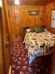 Waterfront Cabin w/ Private Dock & Outdoor Bar near Munising/Manistique - 2-Star