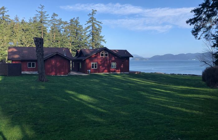 Beautiful farmhouse overlooking water with beach access on a private estate