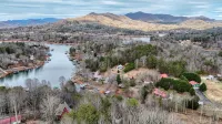 Lakefront Home & Guest House with Two Docks, and Breathtaking Mountain Views!