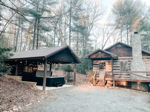 Cozy Cabin in woods with Hot Tub, Porch Swing Bed and Fire Pit in Aska Adventure - 3-Star