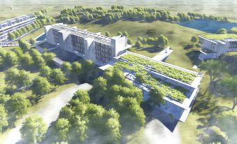 a modern , white building with greenery on the roof is surrounded by trees and water at Jetwing Lake