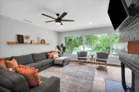 Mid-Century Boho Chic home with Pool, Game Room & Outdoor Playhouse.