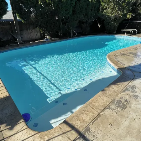 Beautiful Home in quiet neighborhood with a pool and close to stores & highways.