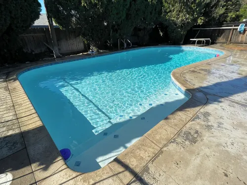 Beautiful Home in quiet neighborhood with a pool and close to stores & highways.